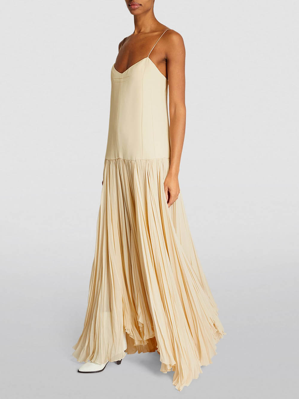 Kleid mit Trägern, tiefer Taille und unregelmäßigem Saum