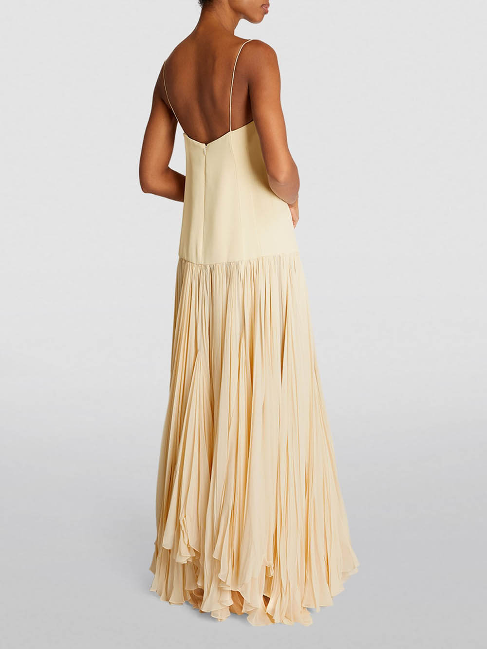 Kleid mit Trägern, tiefer Taille und unregelmäßigem Saum