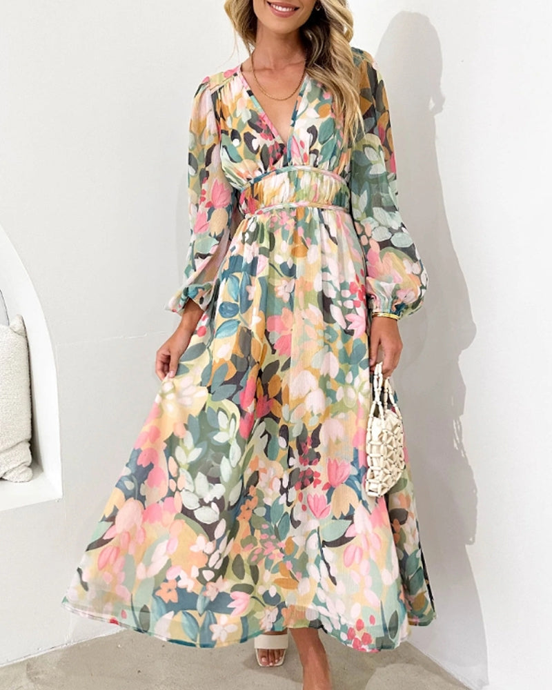 Elegantes langes Kleid mit floralem Muster und ballonförmigen Ärmeln