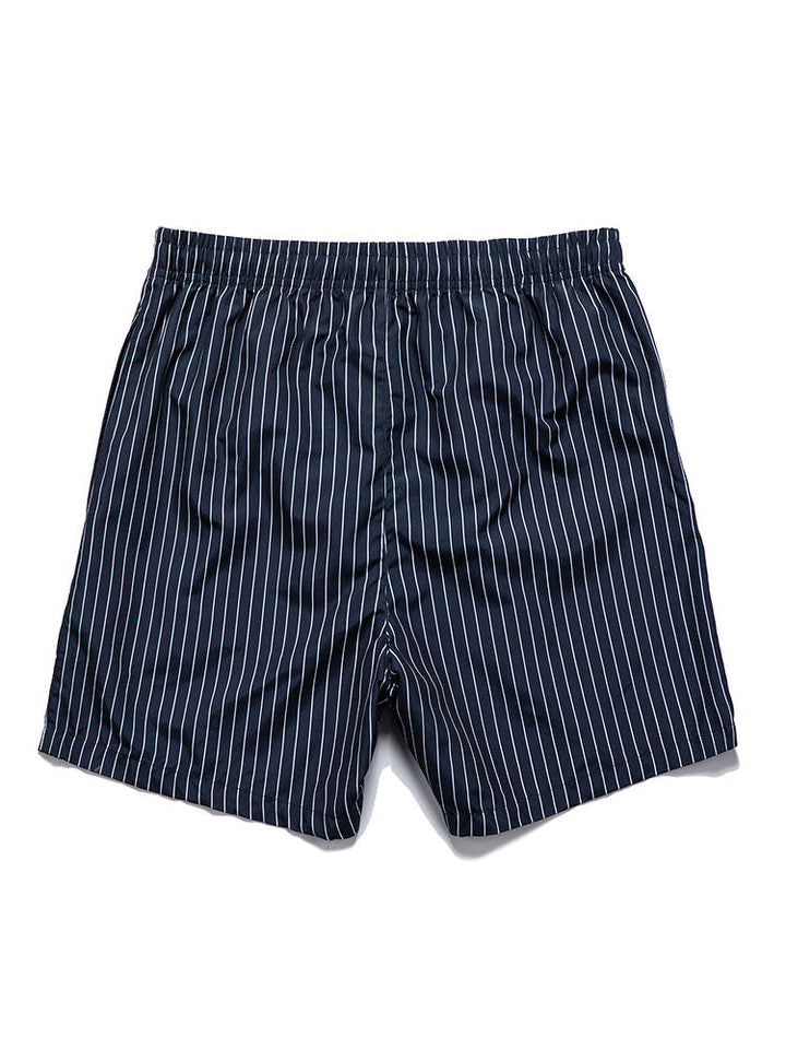 Hemd mit Palmen-Print und Badehose mit Streifenmuster