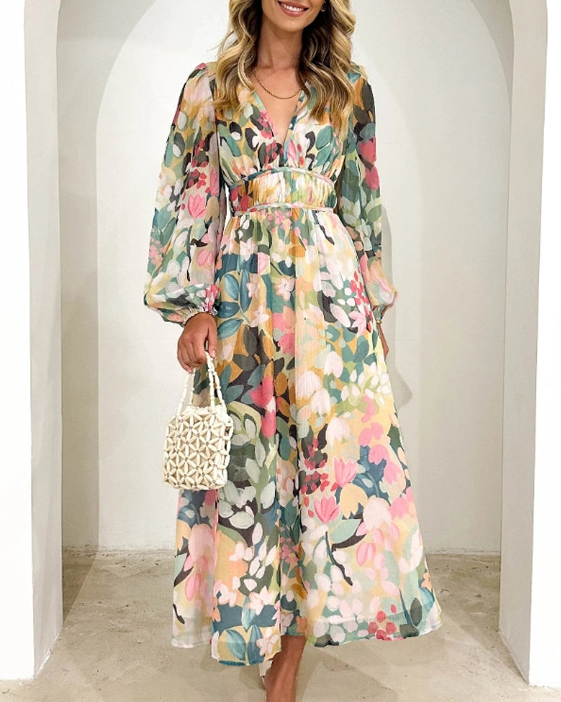 Elegantes langes Kleid mit floralem Muster und ballonförmigen Ärmeln
