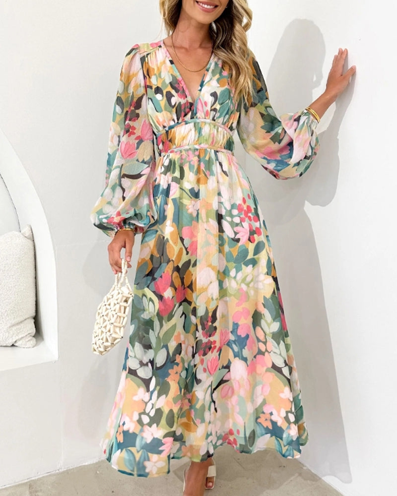 Elegantes langes Kleid mit floralem Muster und ballonförmigen Ärmeln